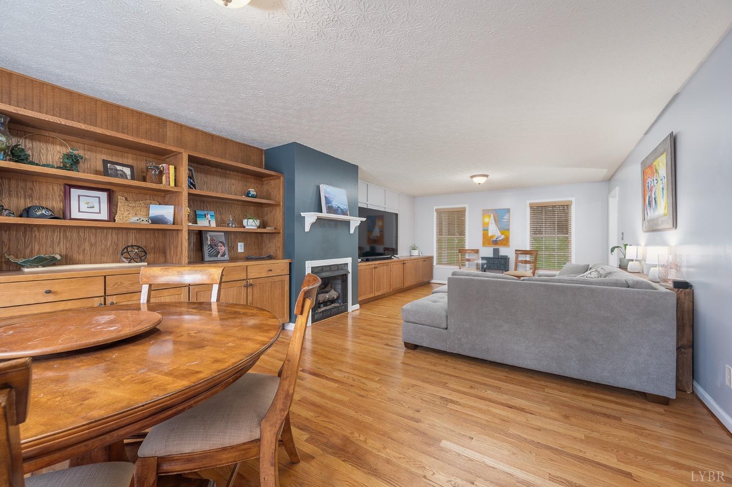 1498 Hooper Road Forest, VA 24551 - Photo 17 of 48 a living room with furniture and a wooden floor