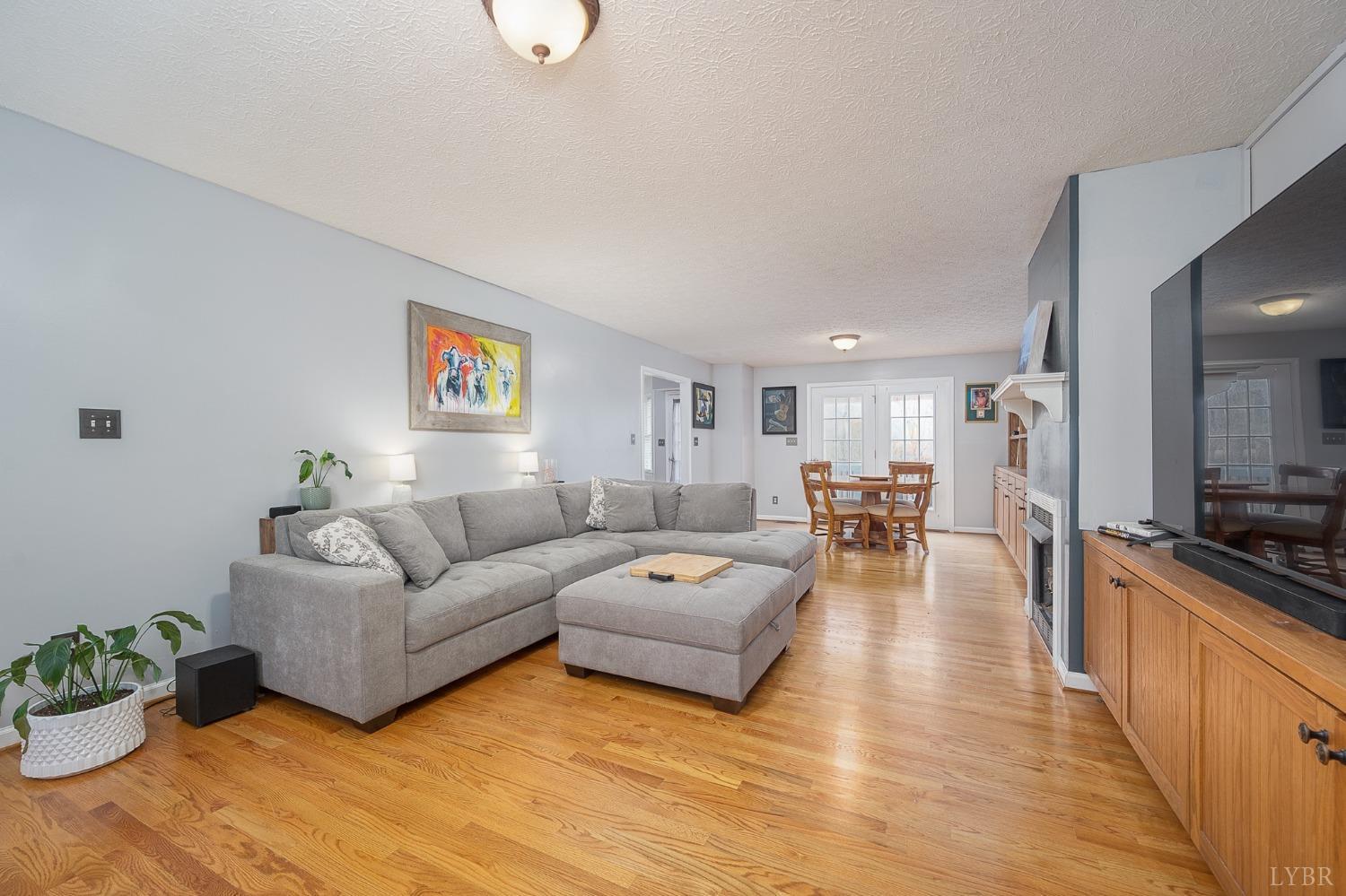 1498 Hooper Road Forest, VA 24551 - Photo 20 of 48 a living room with furniture and a flat screen tv