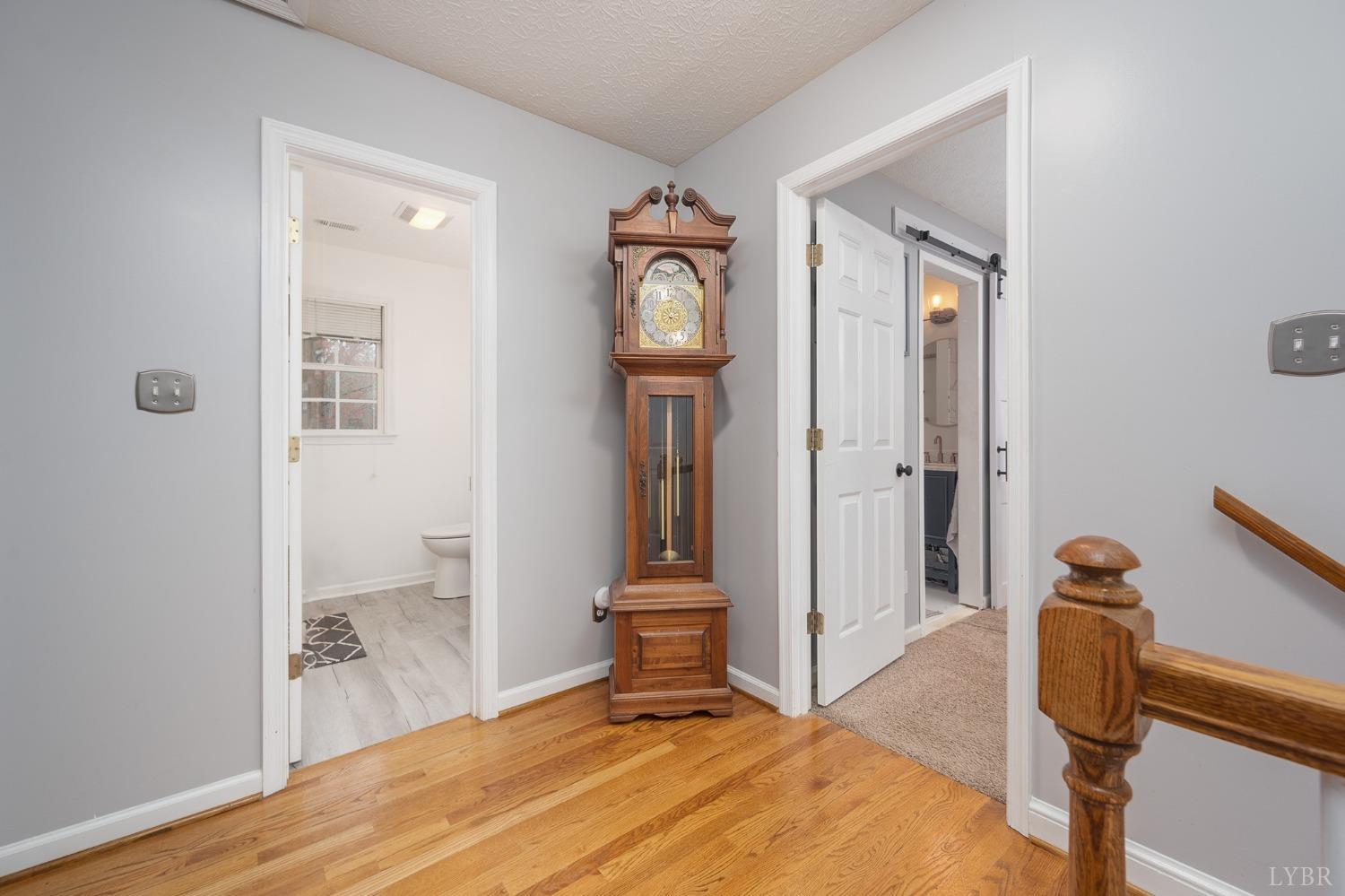 1498 Hooper Road Forest, VA 24551 - Photo 25 of 48 a bedroom with a bed and a mirror