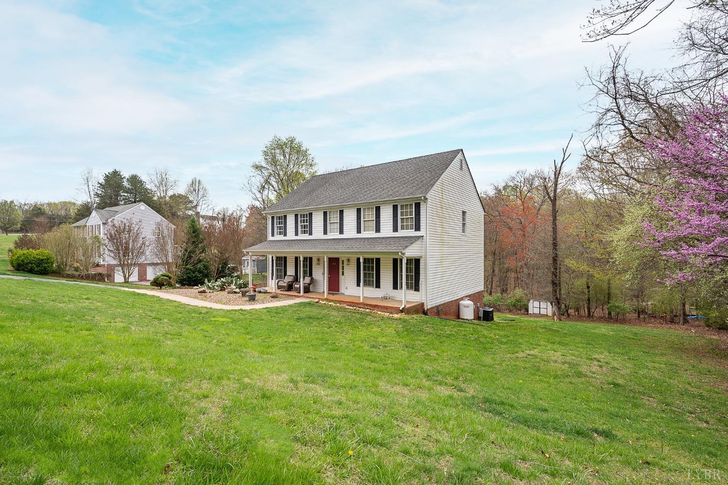 1498 Hooper Road Forest, VA 24551 - Photo 3 of 48 a view of a house with a yard and sitting area