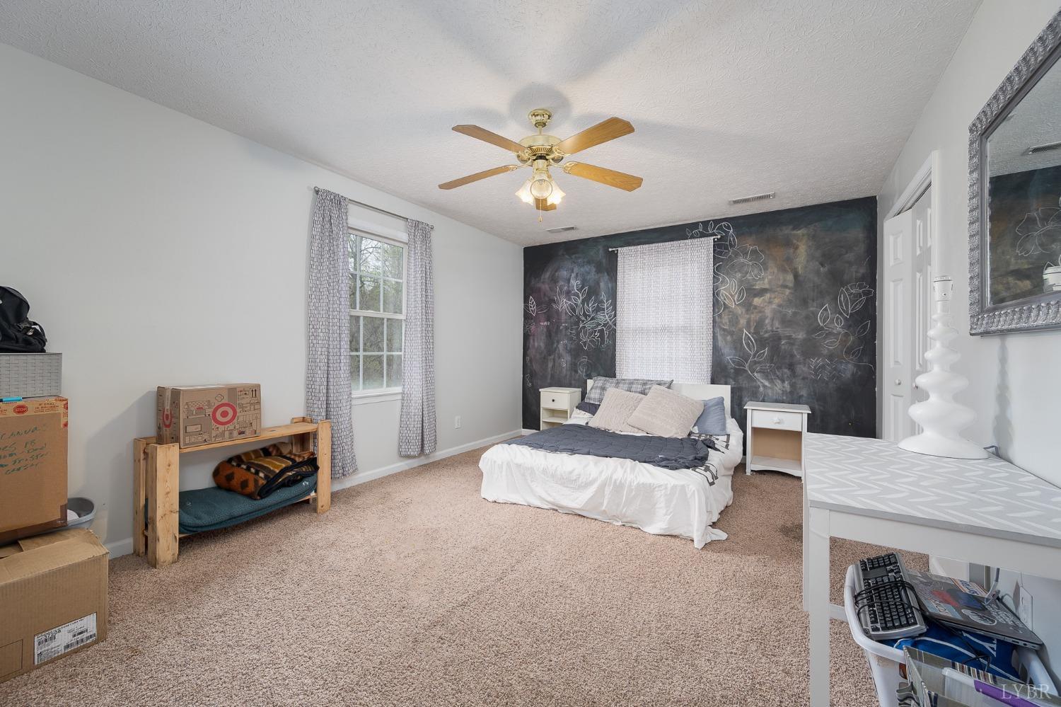 1498 Hooper Road Forest, VA 24551 - Photo 35 of 48 a living room with furniture and a large window