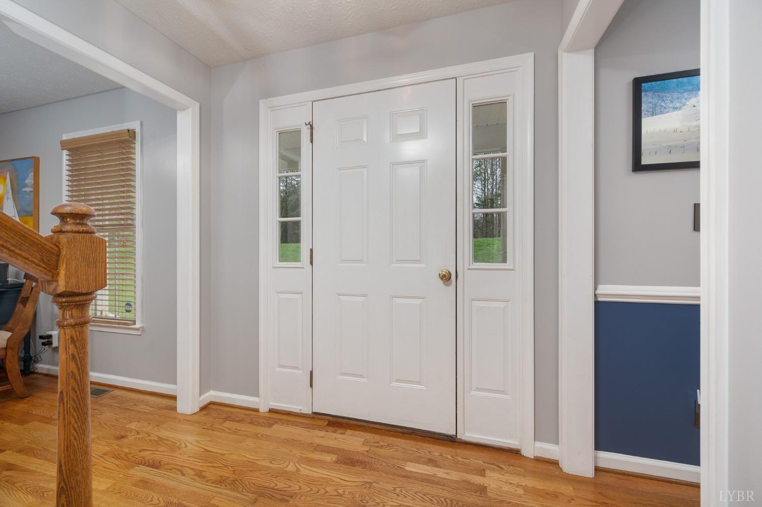 1498 Hooper Road Forest, VA 24551 - Photo 8 of 48 an empty room with wooden floor and windows