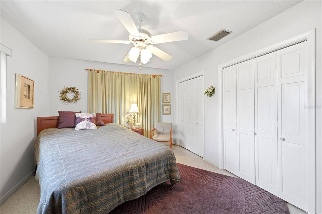 1830 South Mandarin Terrace Inverness, FL 34450 - Photo 47 of 47 a bedroom with a bed and a chandelier