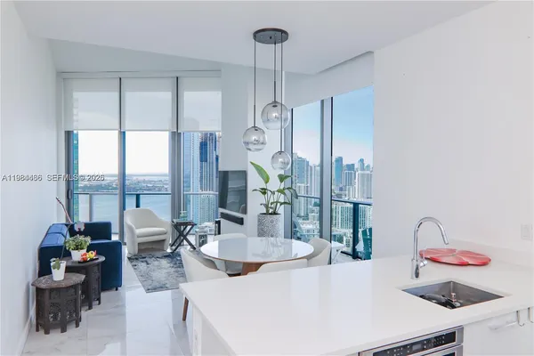 a kitchen with stainless steel appliances granite countertop a sink and a granite counter tops
