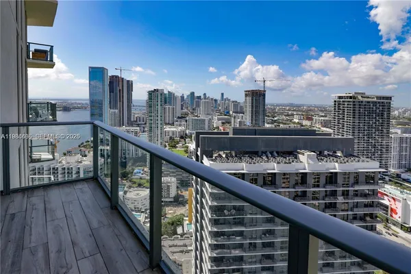 a city view from a balcony with city view