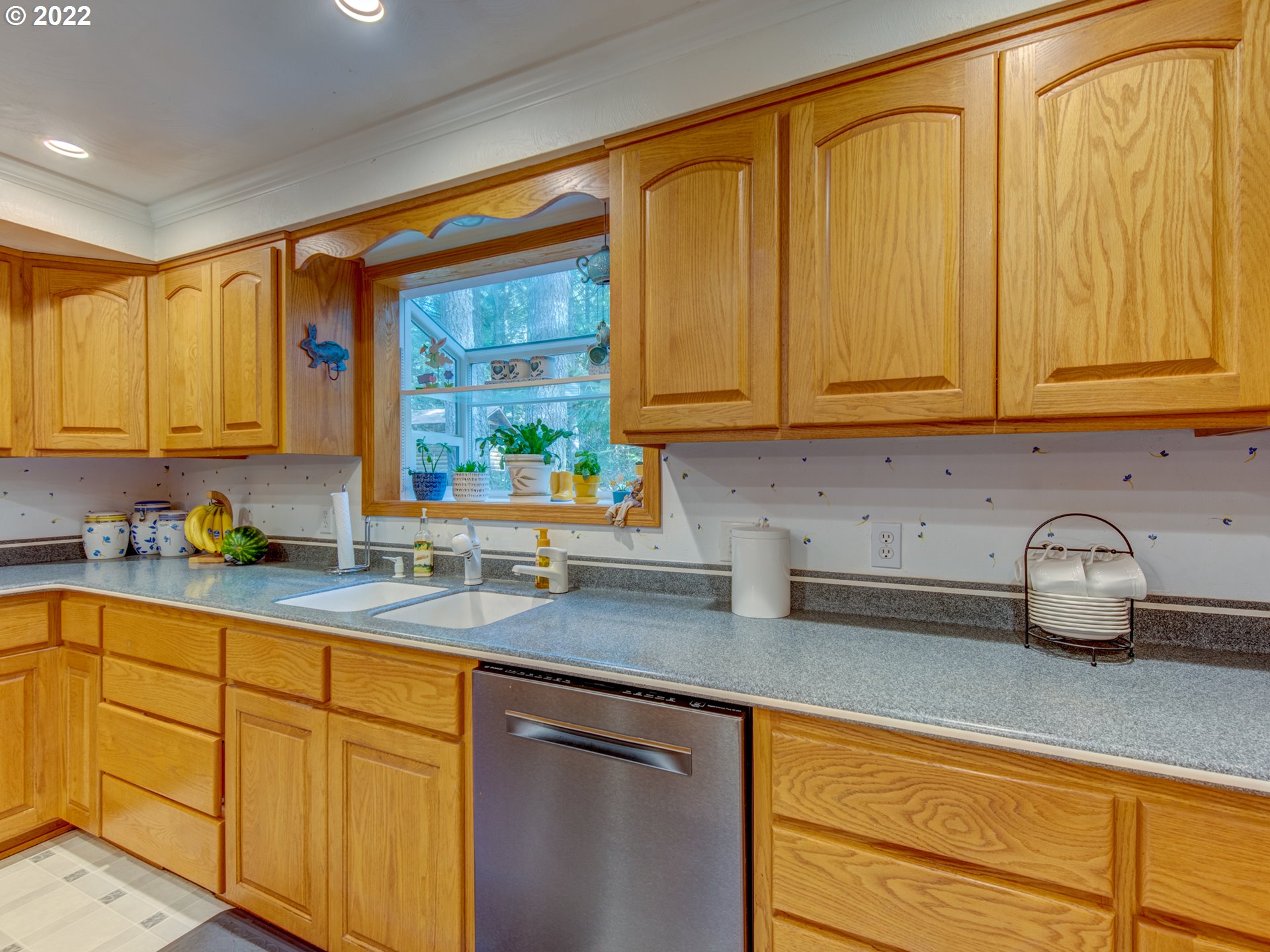 87125 Cedar Flat Road Springfield, OR 97478 - Photo 4 of 32 a kitchen with stainless steel appliances granite countertop a sink a refrigerator and cabinets
