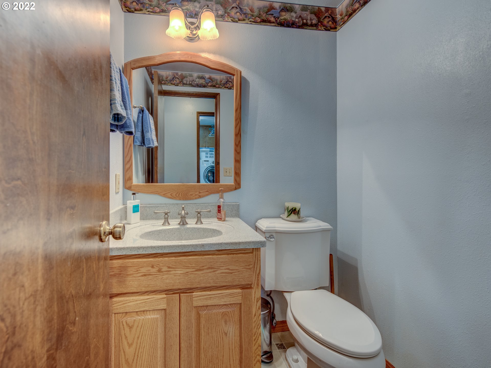87125 Cedar Flat Road Springfield, OR 97478 - Photo 8 of 32 a bathroom with a toilet sink and mirror
