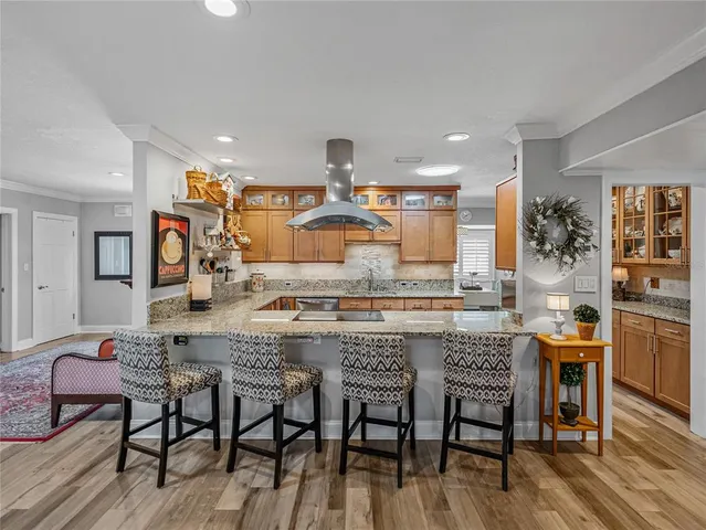a bedroom with a bed couch and a dresser