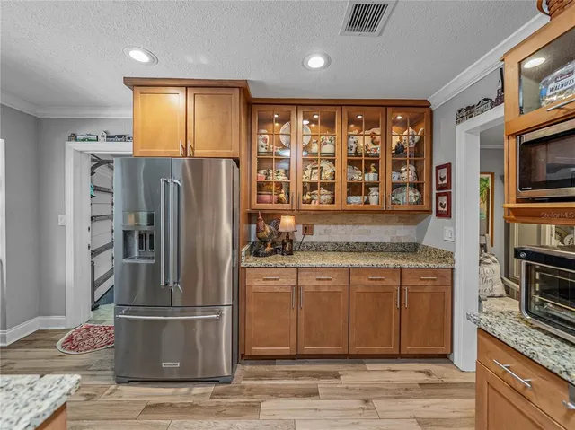 a bedroom with a bed dresser and a window