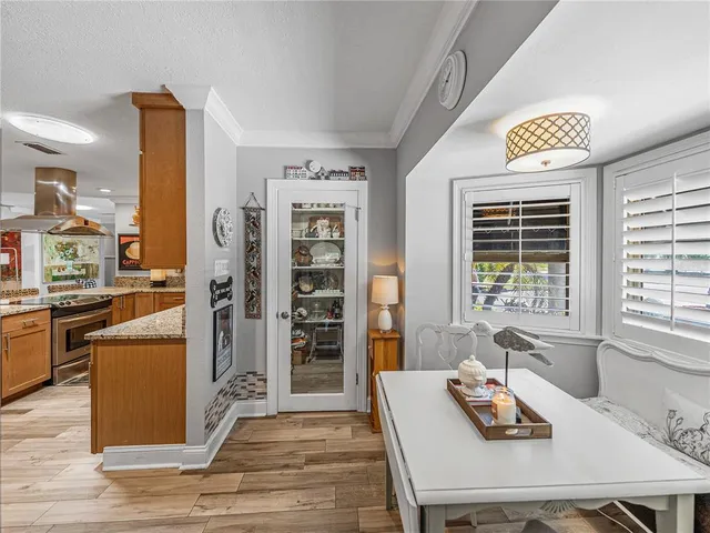 a spacious bedroom with a bed and a flat screen television