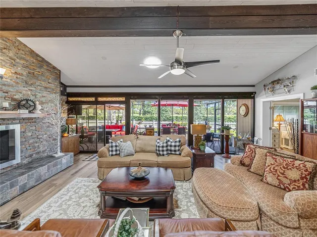 an aerial view of residential houses with outdoor space and lake view