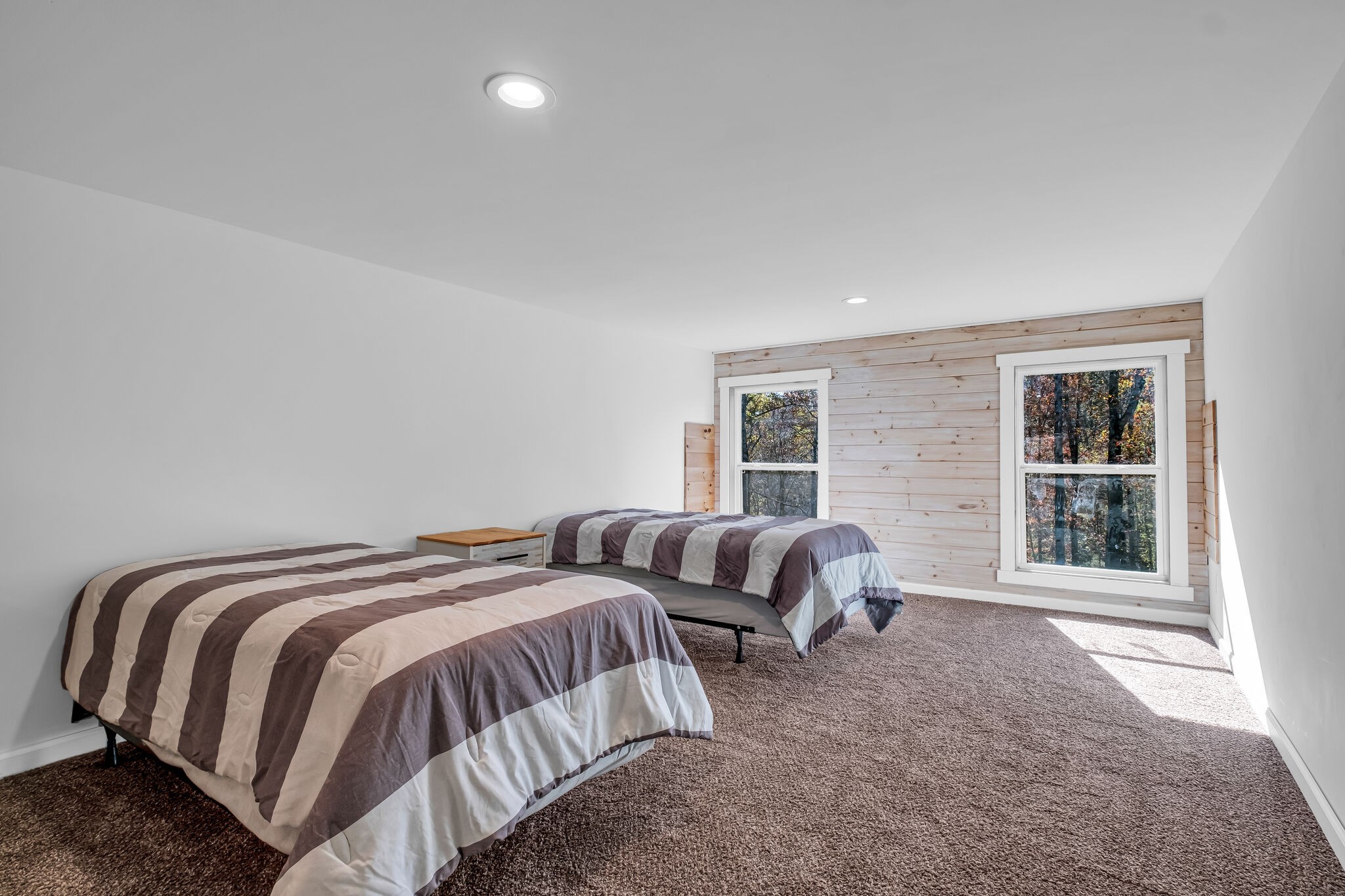 761 Metal Ford Road Hohenwald, TN 38462 - Photo 13 of 60 a bedroom with two beds and a window