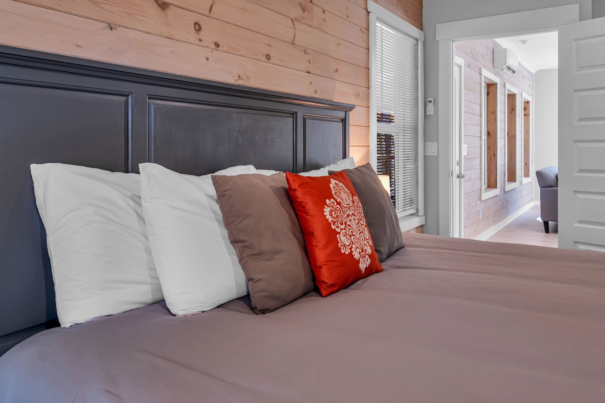 761 Metal Ford Road Hohenwald, TN 38462 - Photo 27 of 60 a view of a bedroom with a bed and large window