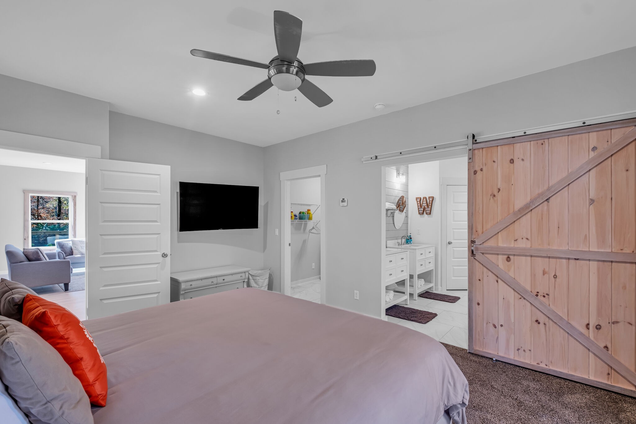 761 Metal Ford Road Hohenwald, TN 38462 - Photo 28 of 60 a bedroom with furniture and a flat screen tv
