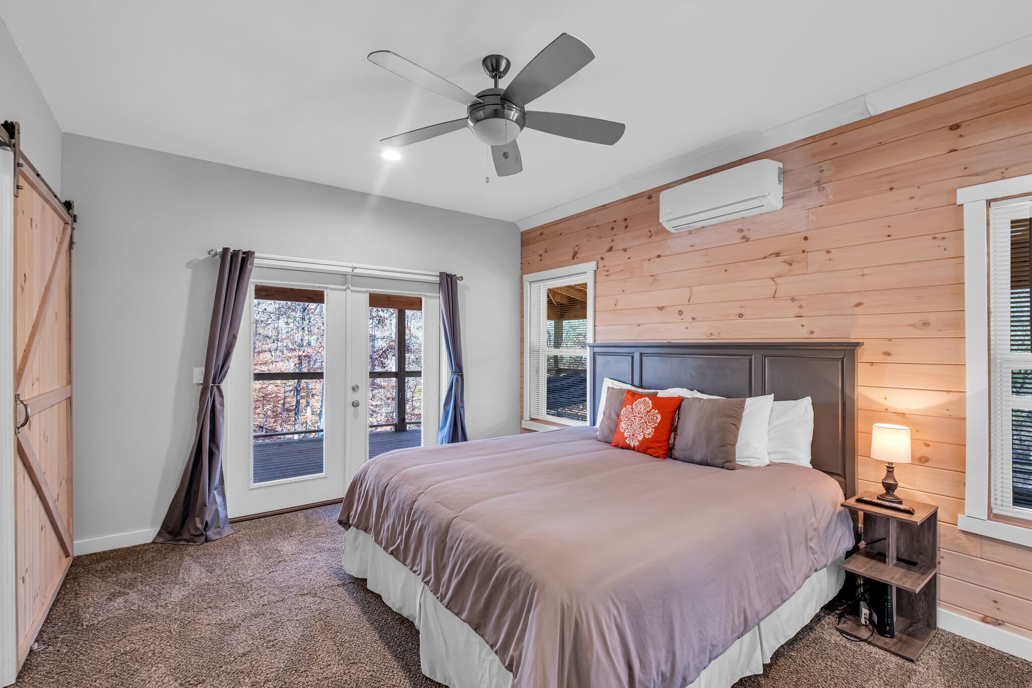 761 Metal Ford Road Hohenwald, TN 38462 - Photo 29 of 60 a bedroom with a large bed and a large window