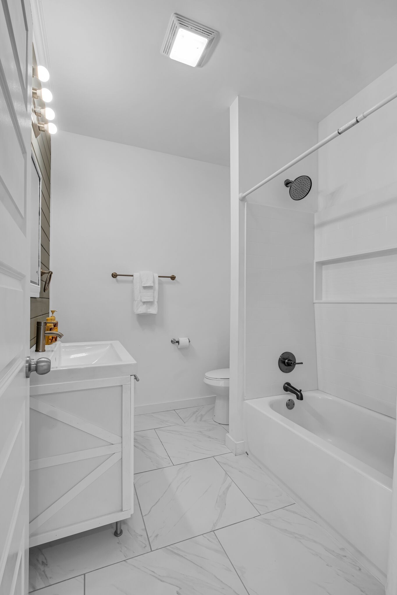 761 Metal Ford Road Hohenwald, TN 38462 - Photo 30 of 60 a bathroom with a sink a toilet and shower