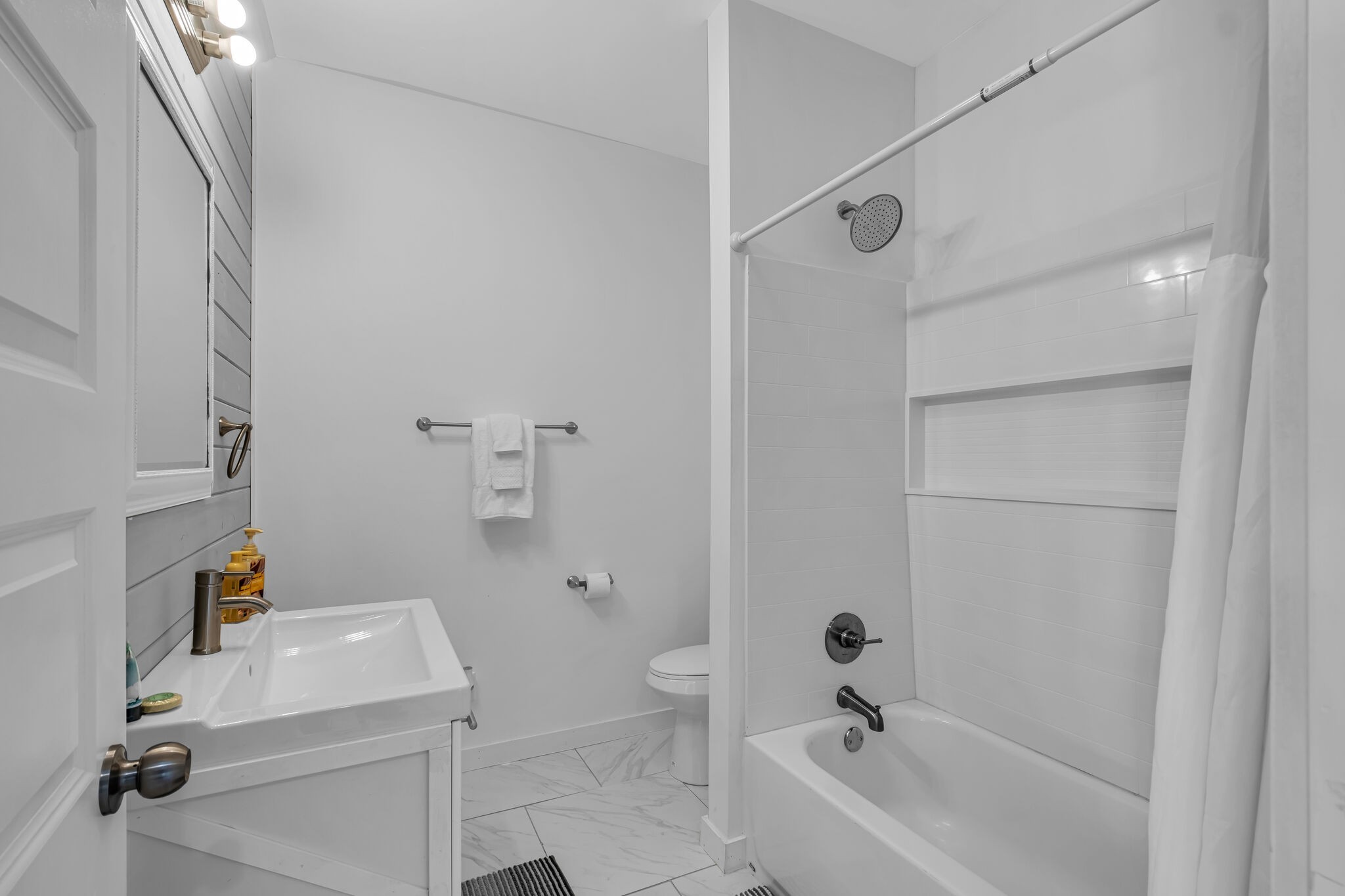 761 Metal Ford Road Hohenwald, TN 38462 - Photo 31 of 60 a bathroom with a sink a toilet and shower