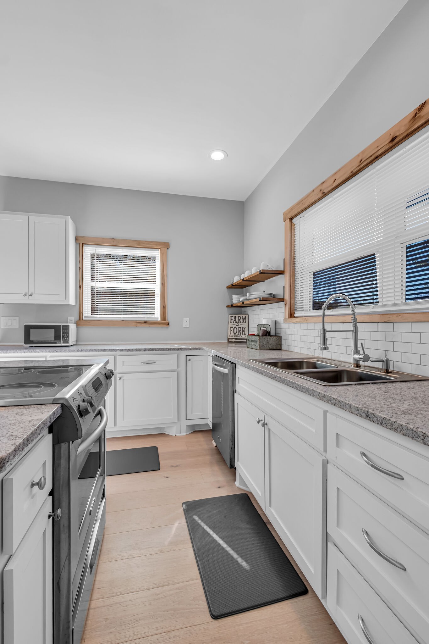 761 Metal Ford Road Hohenwald, TN 38462 - Photo 32 of 60 a kitchen with granite countertop a sink stainless steel appliances and cabinets