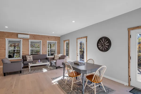 a view of a room with wooden floor