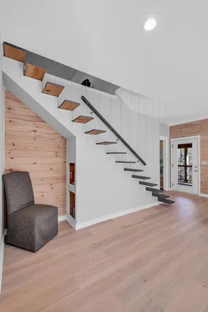 a view of balcony with wooden floor and fence