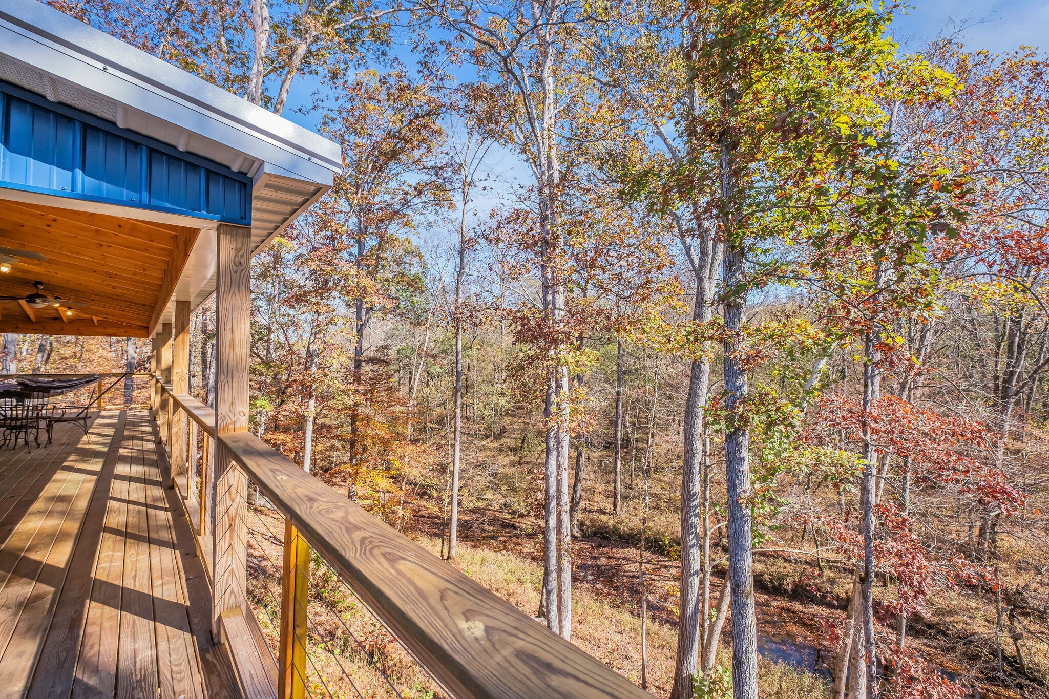 761 Metal Ford Road Hohenwald, TN 38462 - Photo 46 of 60 a view of balcony with wooden floor and fence