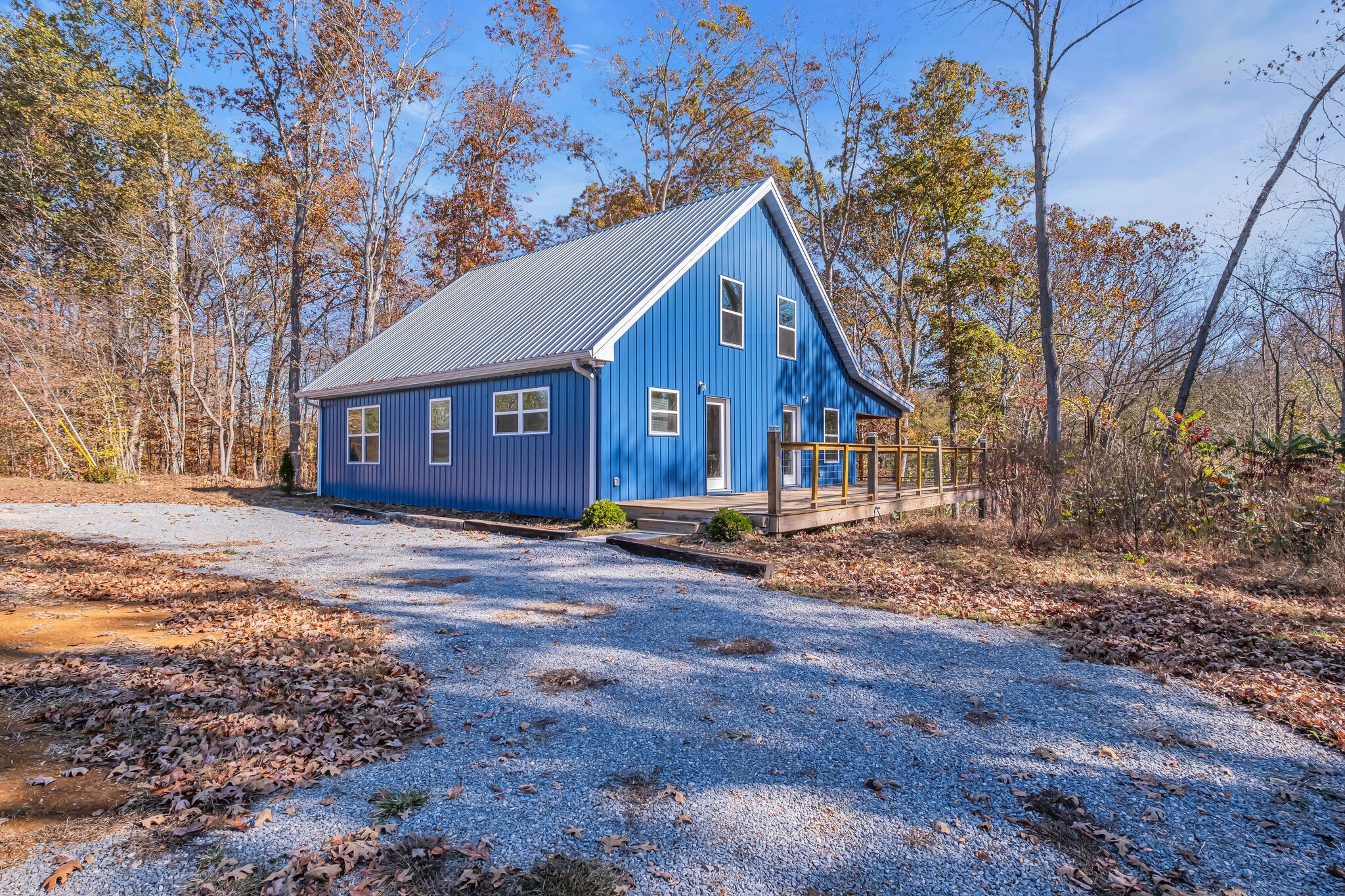 761 Metal Ford Road Hohenwald, TN 38462 - Photo 52 of 60 a view of a house with a yard covered in snow