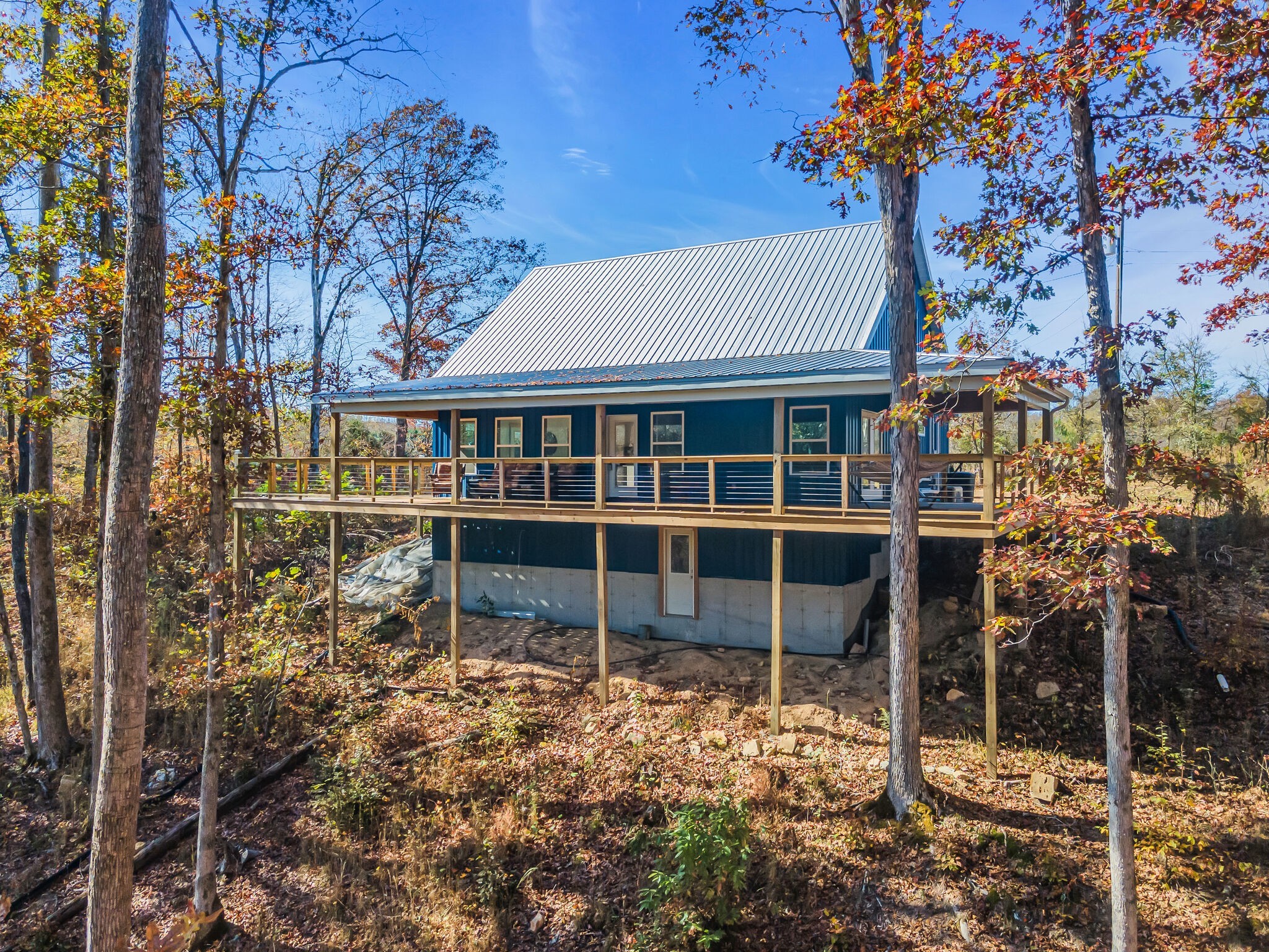 761 Metal Ford Road Hohenwald, TN 38462 - Photo 8 of 60 a view of a house with a window and wooden fence