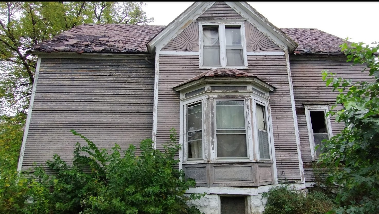 147 West 111th Place Chicago, IL 60628 - Photo 2 of 9 a front view of a house with a yard