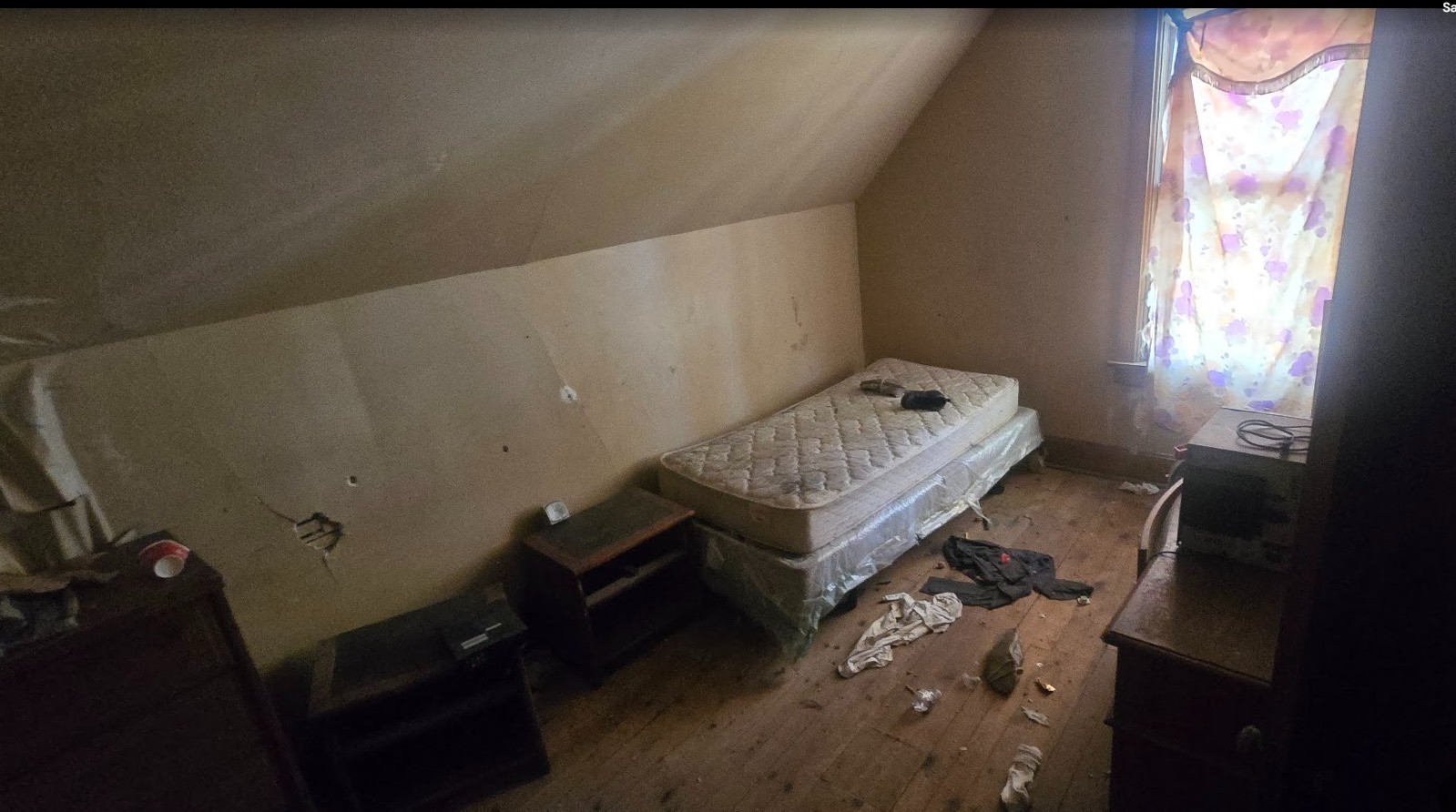 147 West 111th Place Chicago, IL 60628 - Photo 9 of 9 a room with furniture and window