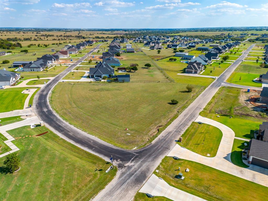 6425 Rigel Road Godley, TX 76044 - Photo 10 of 11 an aerial view of a pool an outdoor seating kitchen and mountain view