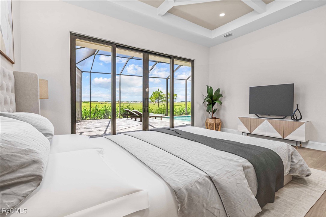 3383 Chestnut Grove Drive Alva, FL 33920 - Photo 13 of 33 a bedroom with a bed and a large window