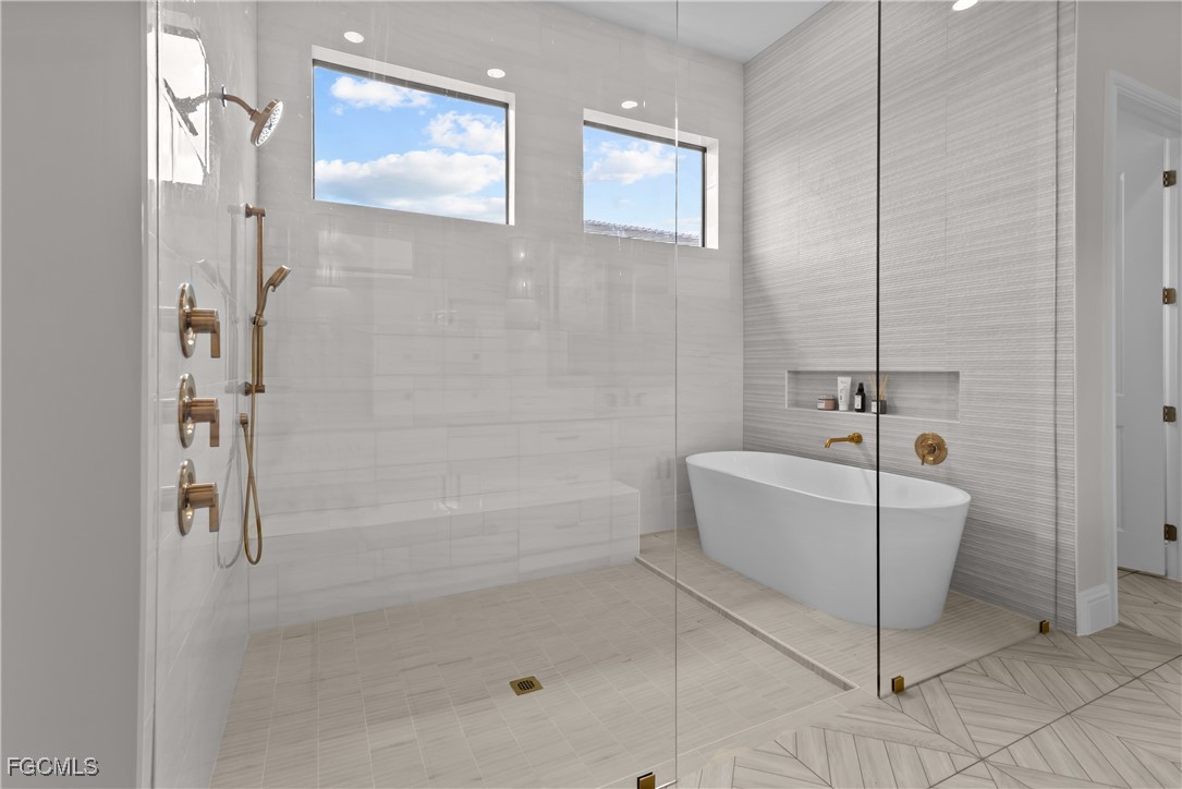 3383 Chestnut Grove Drive Alva, FL 33920 - Photo 15 of 33 a bathroom with a bathtub and shower