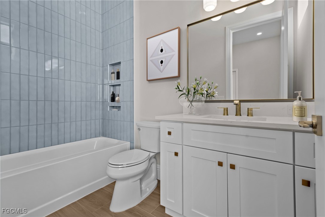 3383 Chestnut Grove Drive Alva, FL 33920 - Photo 17 of 33 a bathroom with a sink a toilet and a bathtub