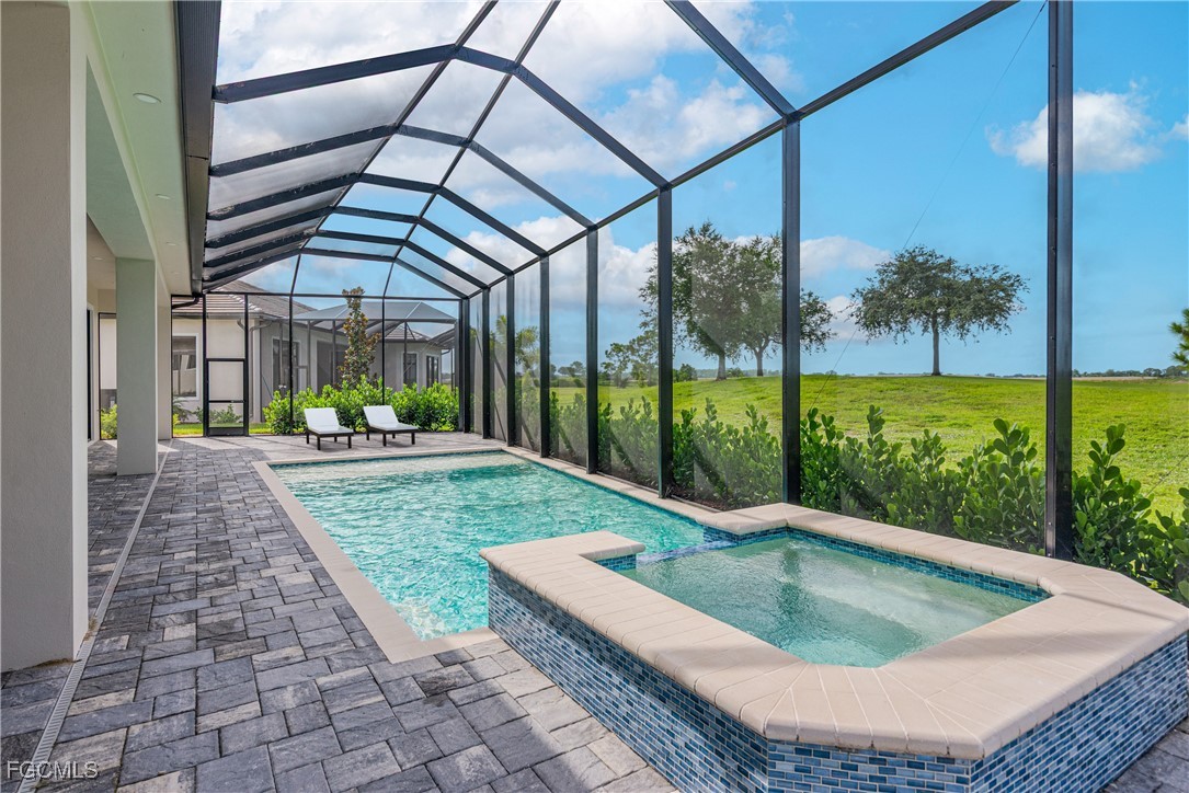 3383 Chestnut Grove Drive Alva, FL 33920 - Photo 23 of 33 a view of a backyard with sitting area