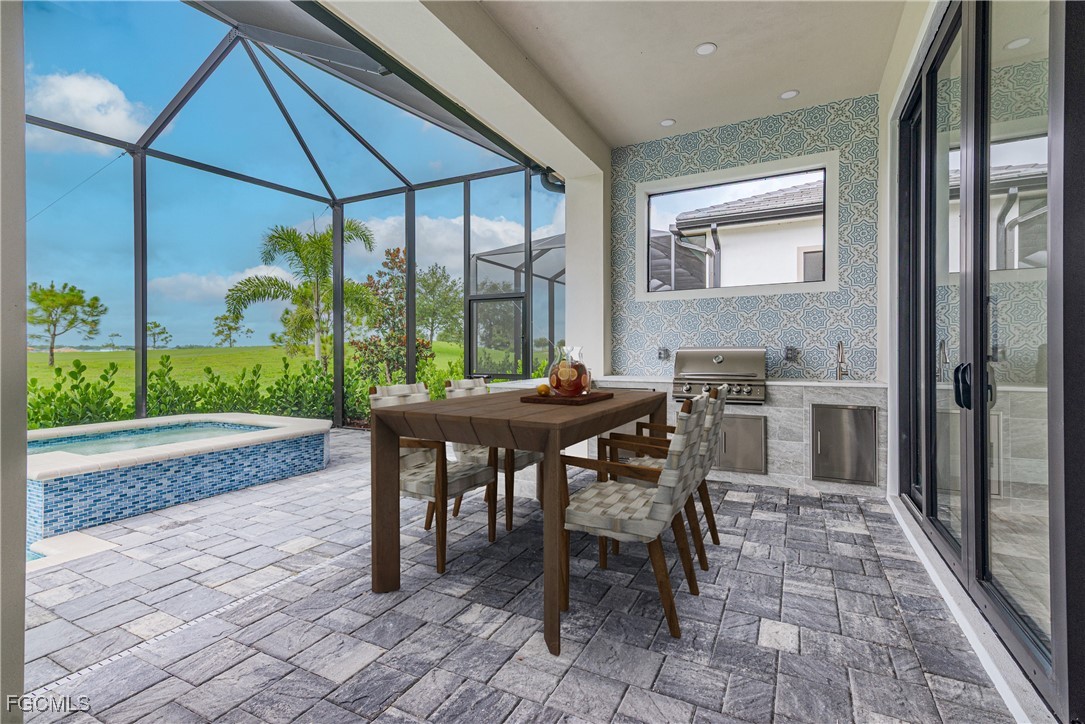 3383 Chestnut Grove Drive Alva, FL 33920 - Photo 26 of 33 a outdoor dining space with furniture