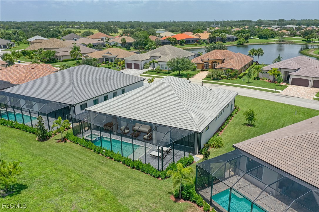 3383 Chestnut Grove Drive Alva, FL 33920 - Photo 28 of 33 an aerial view of a house with garden space and street view
