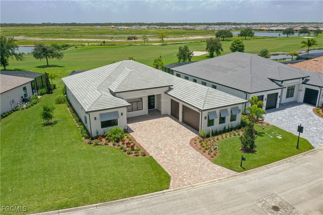 3383 Chestnut Grove Drive Alva, FL 33920 - Photo 3 of 33 an aerial view of a house with outdoor space patio and ocean view