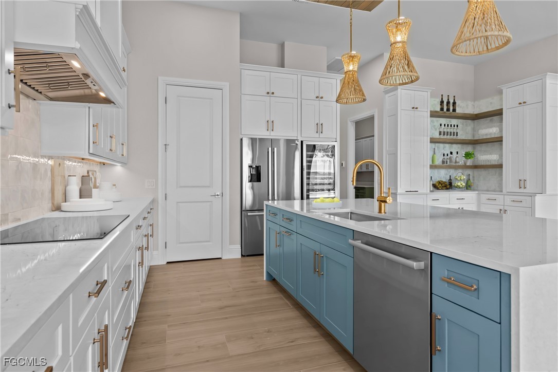 3383 Chestnut Grove Drive Alva, FL 33920 - Photo 7 of 33 a large kitchen with cabinets a sink and dishwasher