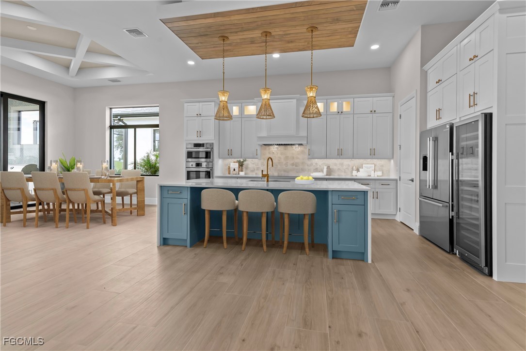 3383 Chestnut Grove Drive Alva, FL 33920 - Photo 9 of 33 a large kitchen with a table and chairs