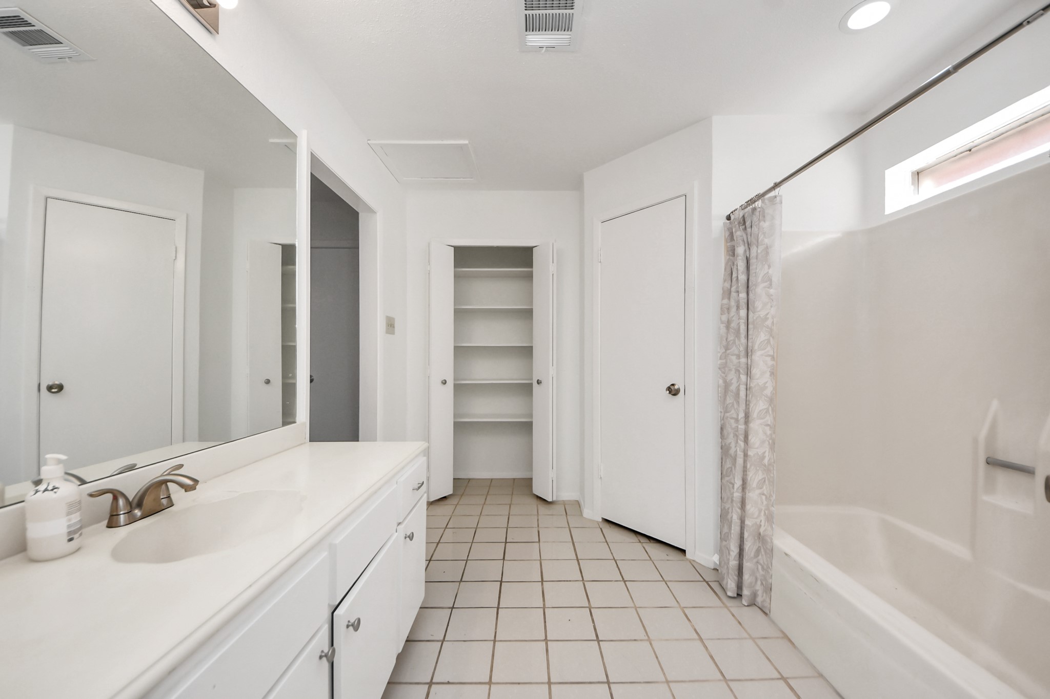 5306 Mossgrey Lane Spring, TX 77373 - Photo 12 of 19 a spacious bathroom with a bathtub sink and toilet