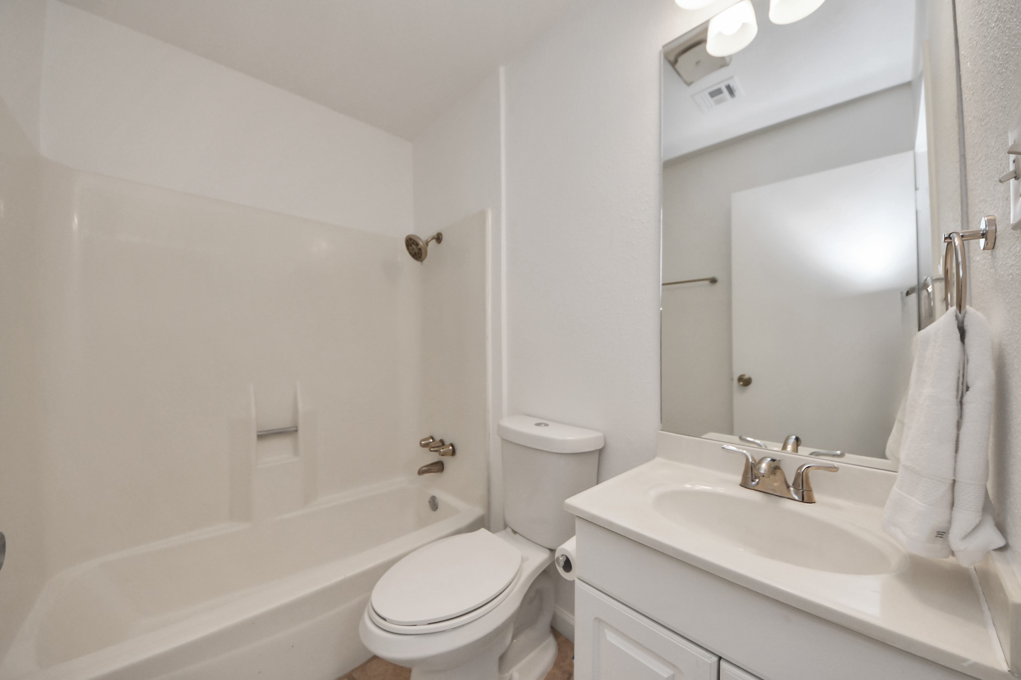 5306 Mossgrey Lane Spring, TX 77373 - Photo 14 of 19 a bathroom with a sink toilet vanity and shower