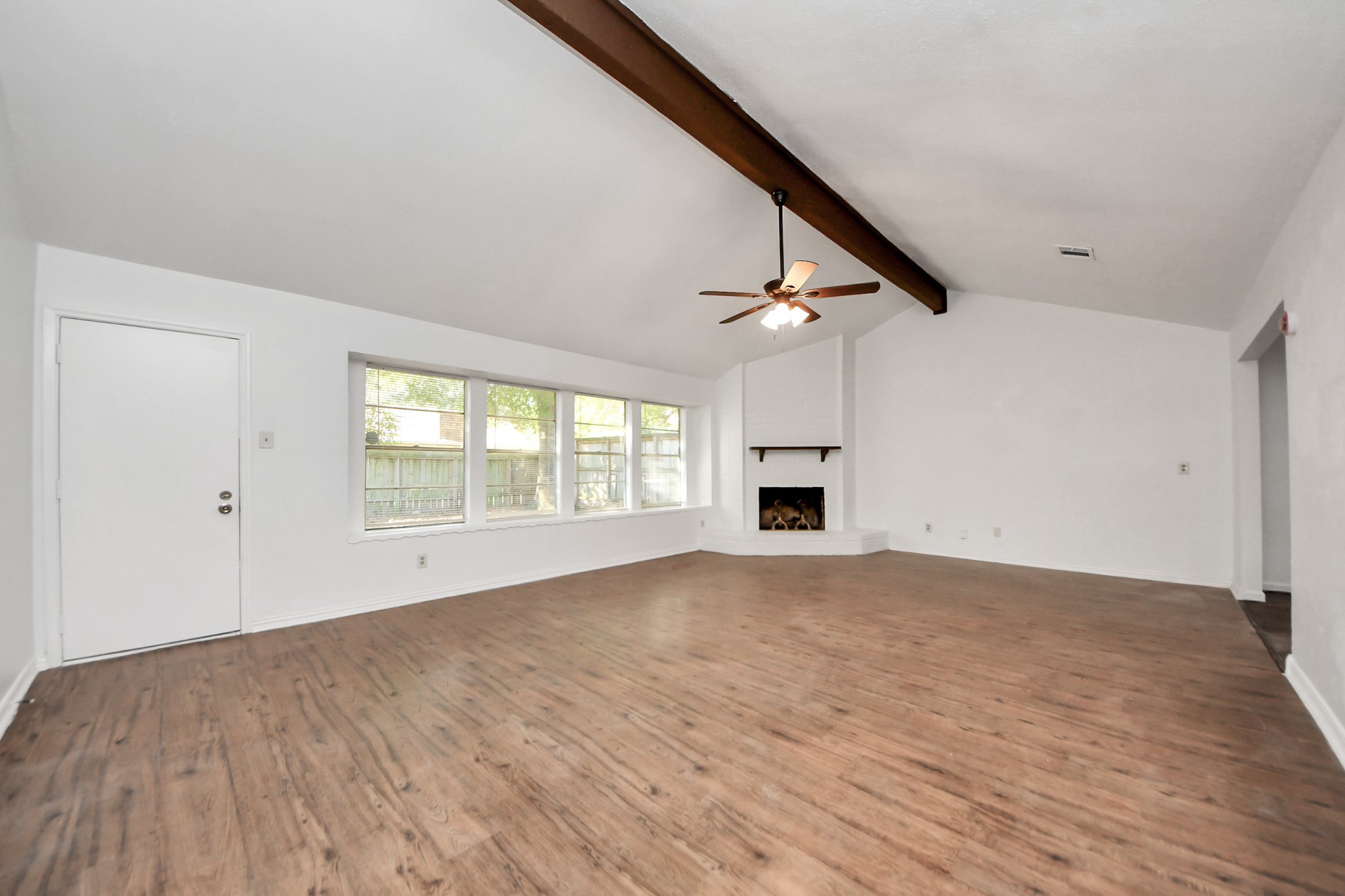 5306 Mossgrey Lane Spring, TX 77373 - Photo 3 of 19 a view of empty room with wooden floor and fan