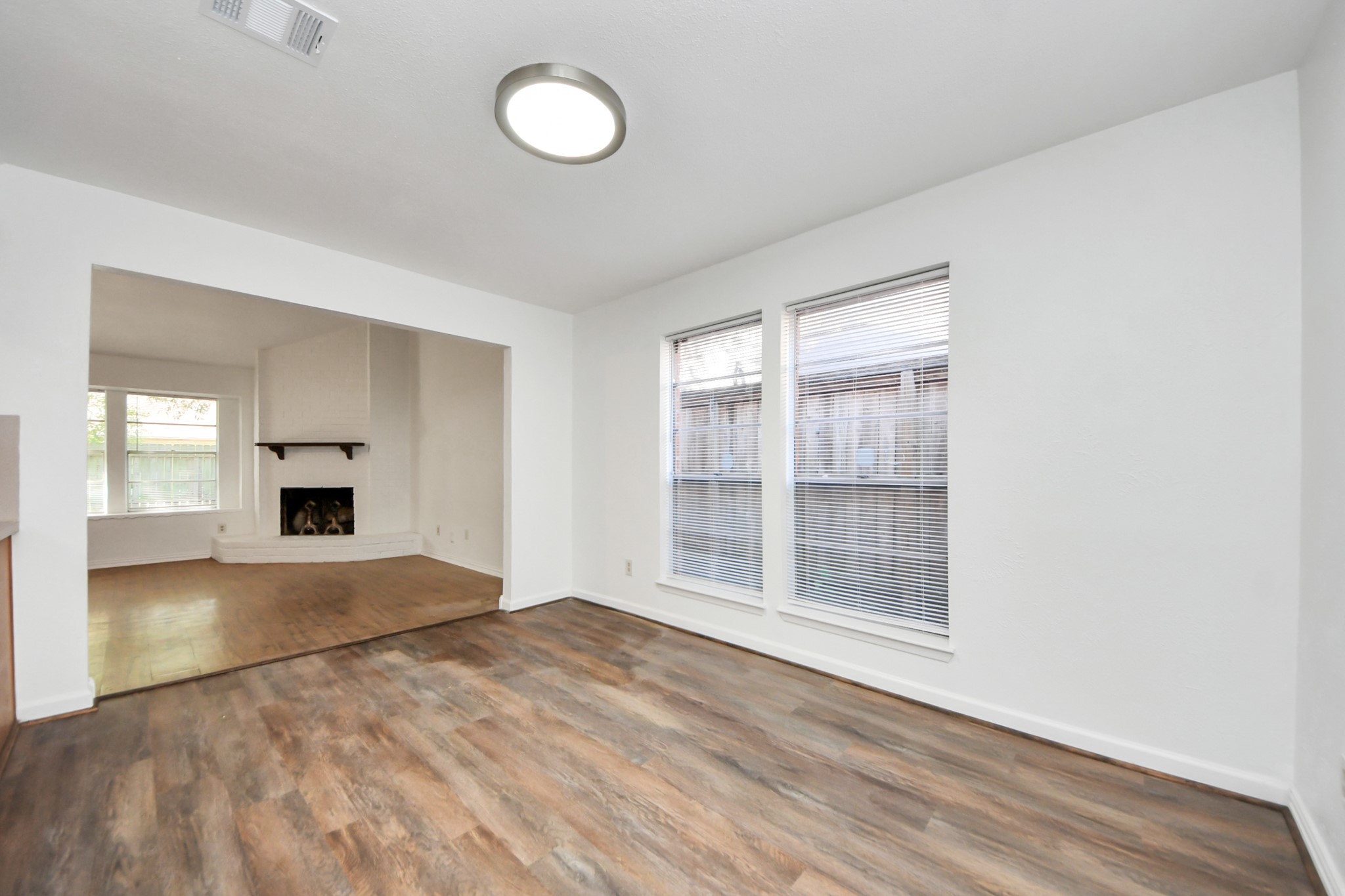 5306 Mossgrey Lane Spring, TX 77373 - Photo 5 of 19 an empty room with wooden floor and windows