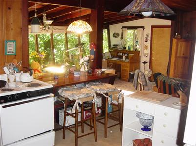 8446 Nazielle Road Forestville, CA 95436 - Photo 8 of 11 a kitchen with a table chairs and a dining table