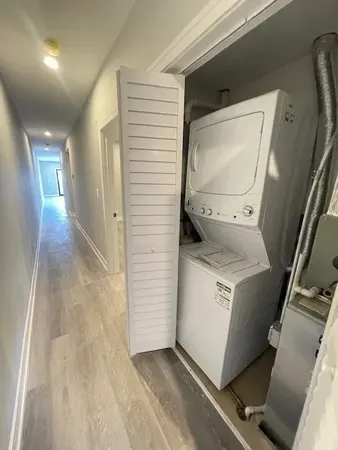 a view of storage and utility room with washer and dryer