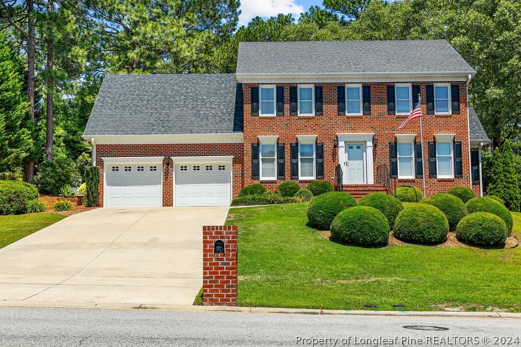 300 Shawcroft Road Fayetteville, NC 28311 - Photo 1 of 42 a front view of a house with a yard