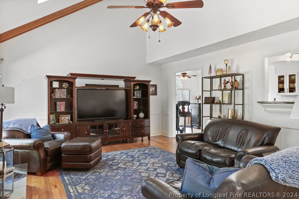 300 Shawcroft Road Fayetteville, NC 28311 - Photo 11 of 42 a living room with furniture and a flat screen tv