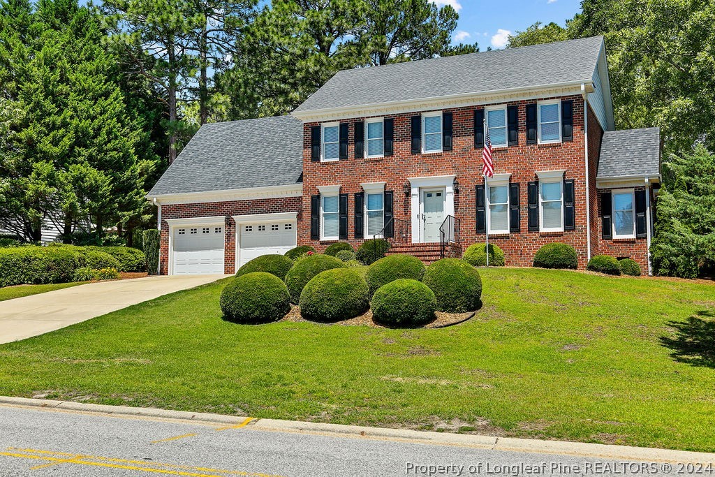 300 Shawcroft Road Fayetteville, NC 28311 - Photo 2 of 42 a view of a house with a yard and a garden