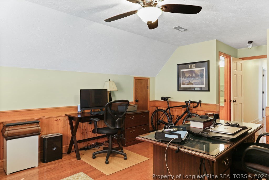 300 Shawcroft Road Fayetteville, NC 28311 - Photo 26 of 42 a view of a workspace with furniture and a ceiling fan