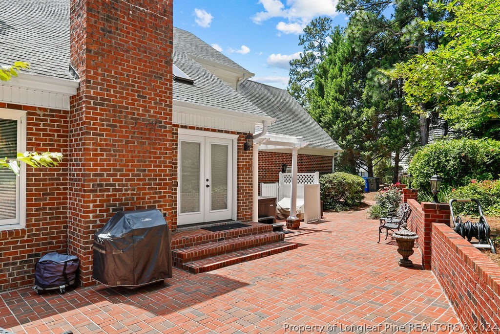 300 Shawcroft Road Fayetteville, NC 28311 - Photo 34 of 42 a view of a patio with couches and a potted plant on a table